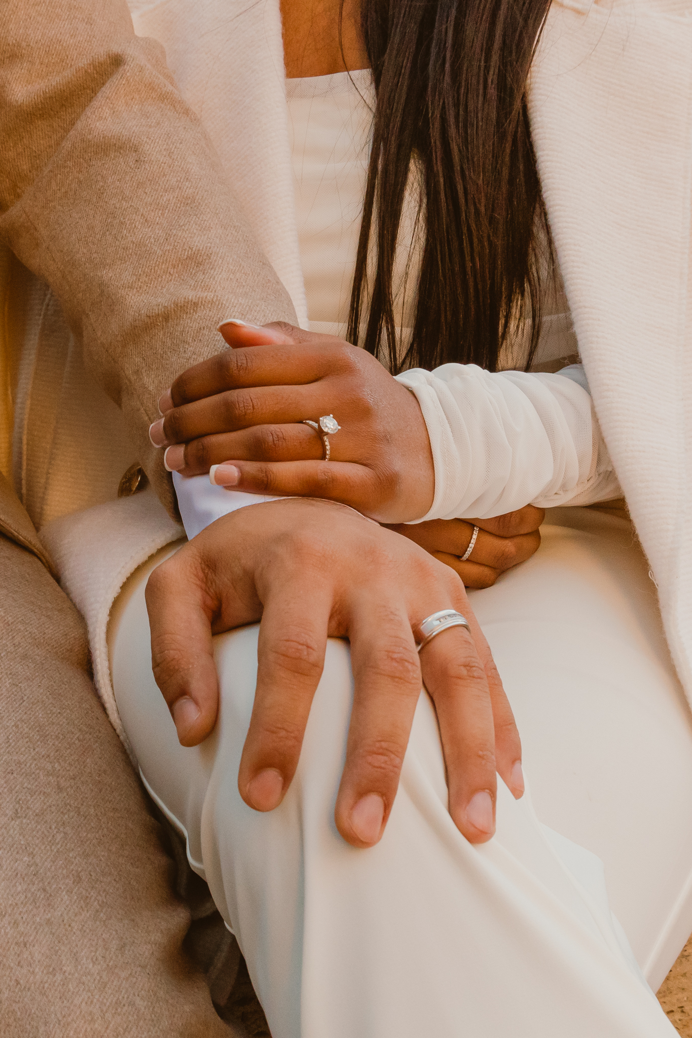 Groom sitting with his partner-capturing a modern couple